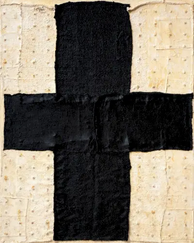 Grafika namalowana na krakersach z czarnym krzyżem