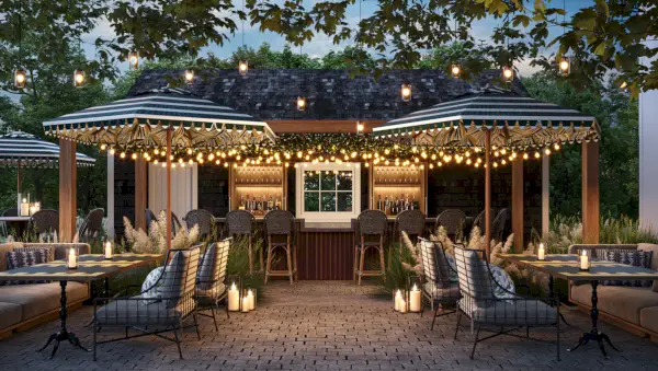 Un bar all'aperto e una capanna con luci pendenti e lanterne